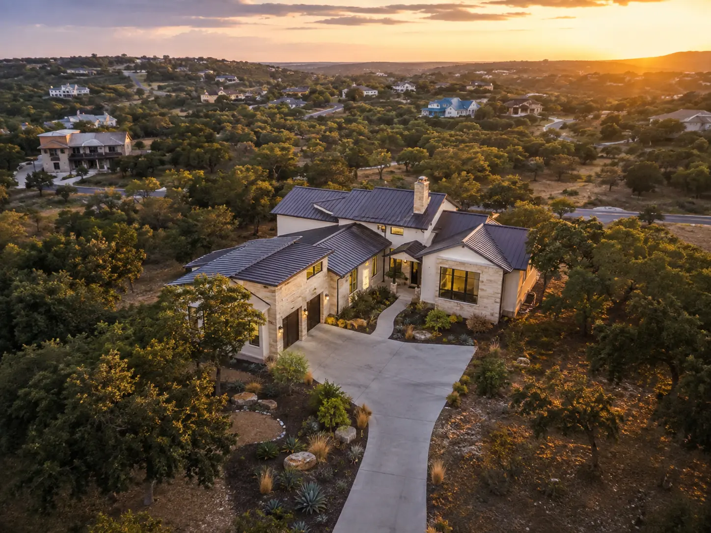 Aerial view of a modern Texas home and its surrounding property